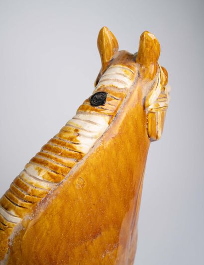 Pair of polychrome ceramic horse statues...