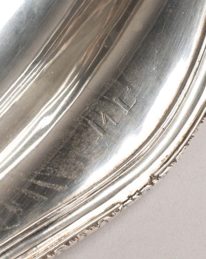 Plain silver basket with a net-like border,...