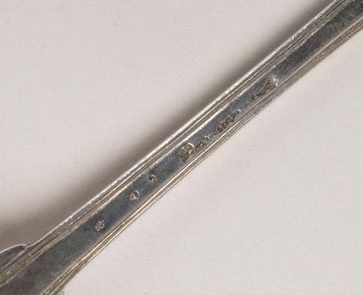 Silver stew spoon, with decorative ridges....