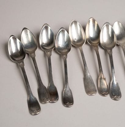 Set of 17 small silver spoons, marked with...