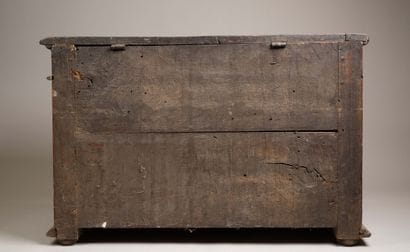 A quadrangular chest made of molded and carved...