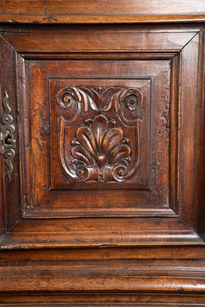 Molded and carved walnut sideboard, decorated...