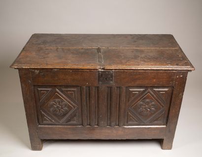 Molded and carved oak chest, decorated with...