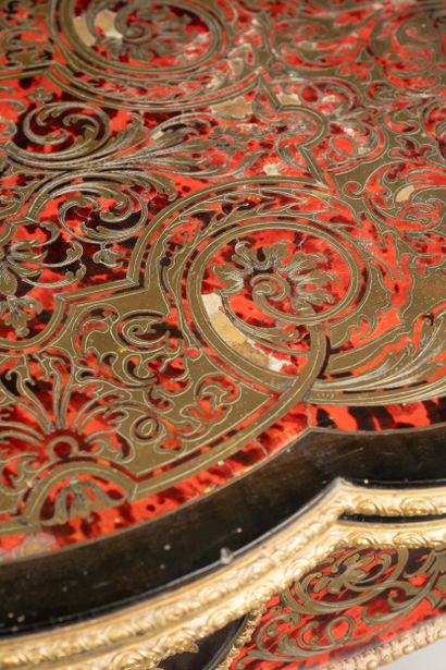 Game table with a broken-shaped top in blackened...