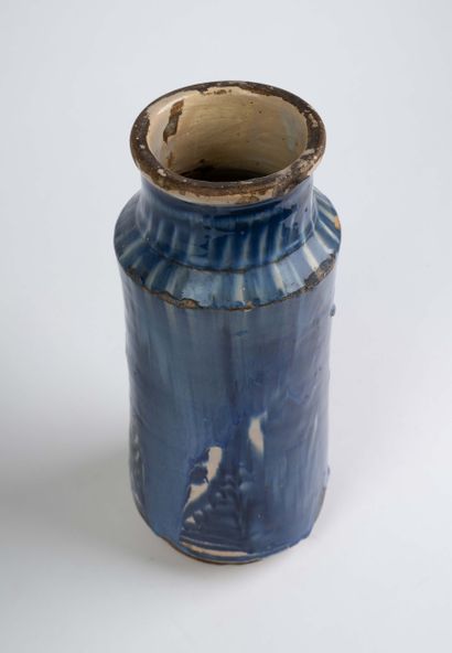 Earthenware albarello with blue flamed decoration....
