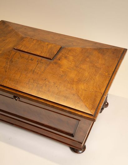 A bottle cooler in the shape of a sarcophagus,...
