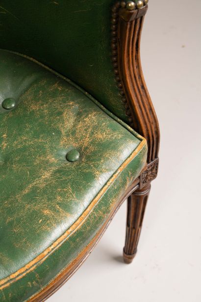 Cane-seated office chair with a molded wooden...