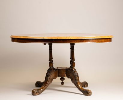 A light-colored wood and veneer coffee table...