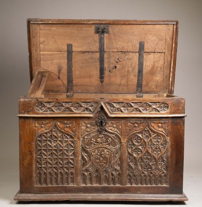 A quadrangular chest made of molded and carved...