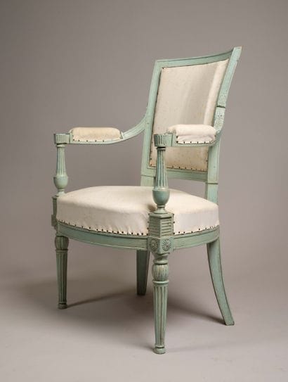 Armchair with a cabriolet back made of molded...