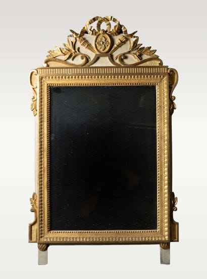 Mirror with a molded, carved wooden pediment,...