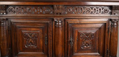 Molded and carved walnut sideboard, decorated...