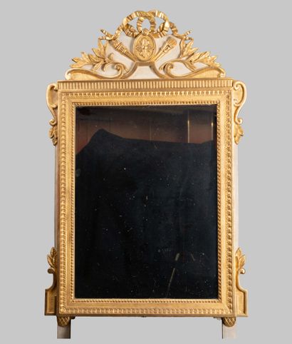 Mirror with a molded, carved wooden pediment,...