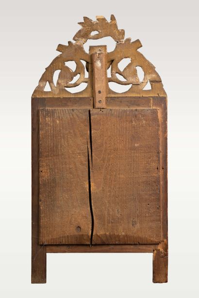 Wall-mounted mirror with a molded, carved,...