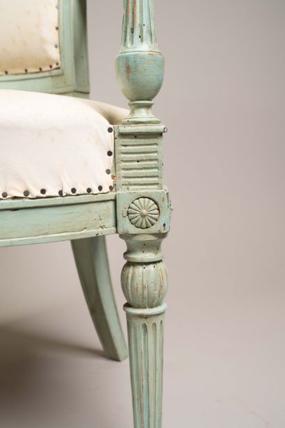 Armchair with a cabriolet back made of molded...