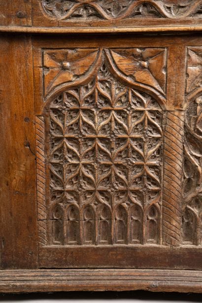 A quadrangular chest made of molded and carved...