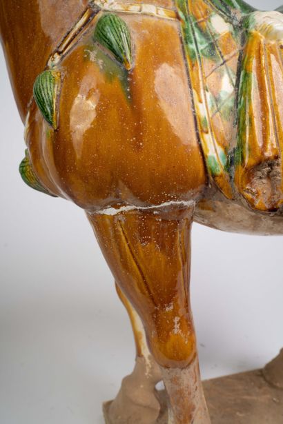 Pair of polychrome ceramic horse statues...