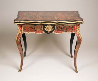 Game table with a broken-shaped top in blackened...