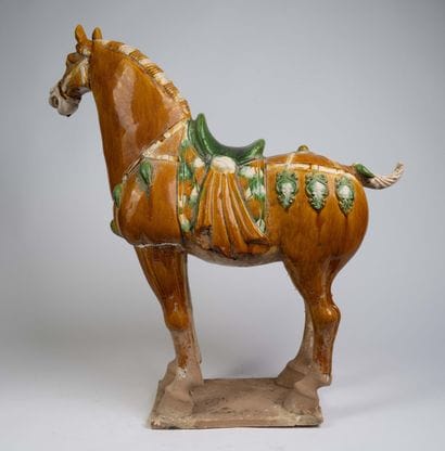 Pair of polychrome ceramic horse statues...