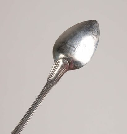Set of 17 small silver spoons, marked with...