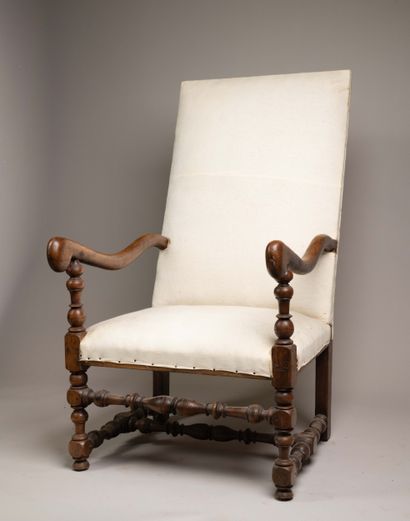 Armchair with a flat, quadrangular high back...