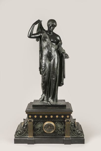 Patinated, gilded and engraved bronze clock...