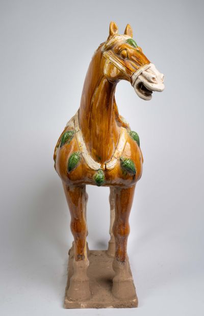 Pair of polychrome ceramic horse statues...