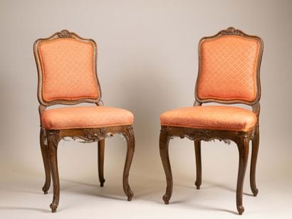 A pair of chairs with Queen Anne-style backs,...