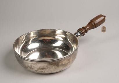 Silver utensil with a plain body and a laminated...