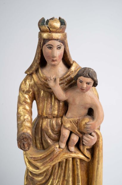 Carved, polychrome, and gilded wooden Virgin...