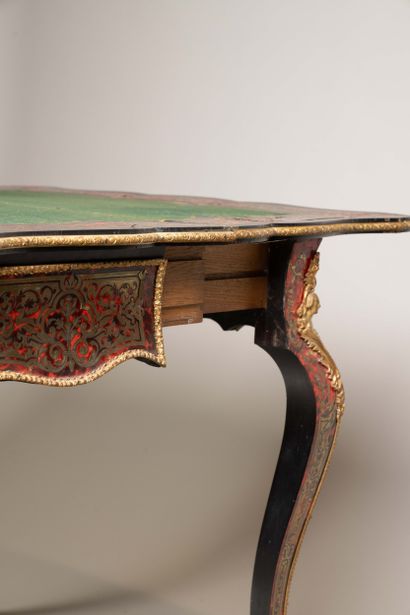 Game table with a broken-shaped top in blackened...