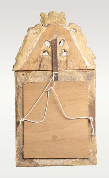 Wall-mounted mirror with a molded, carved,...