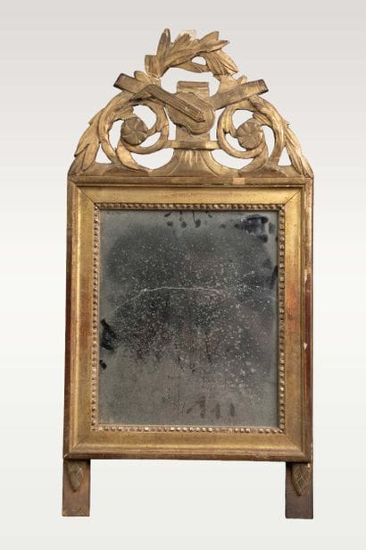 Wall-mounted mirror with a molded, carved,...