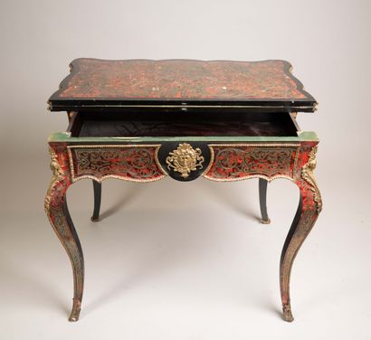 Game table with a broken-shaped top in blackened...