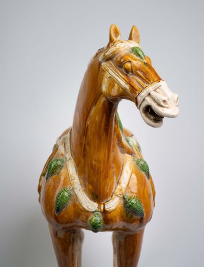 Pair of polychrome ceramic horse statues...
