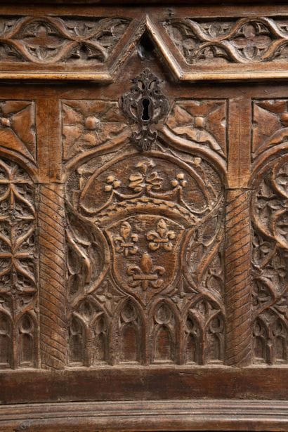 A quadrangular chest made of molded and carved...