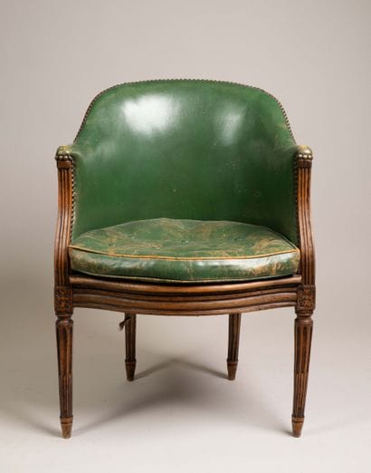 Cane-seated office chair with a molded wooden...