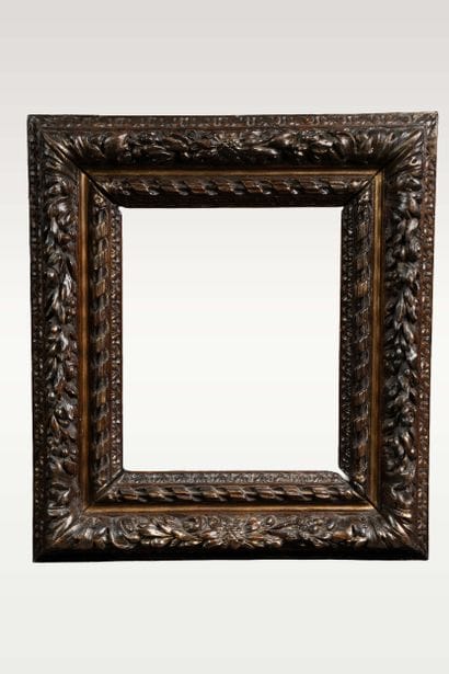 Old wooden frame carved with plant motifs
(refinished)
26...
