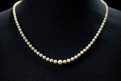 Necklace featuring a cascade of 105 white...