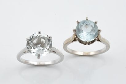 Two solitaire rings set with an aquamarine...