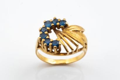 Ring featuring a stylized “horseshoe” or...