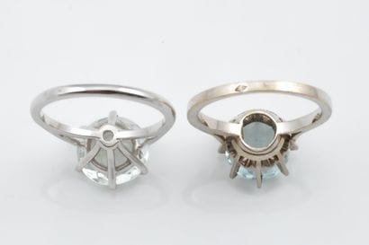 Two solitaire rings set with an aquamarine...