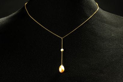 Tie necklace consisting of a yellow gold...