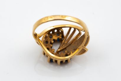 Ring featuring a stylized “horseshoe” or...