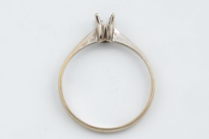 A small solitaire ring set in white gold...