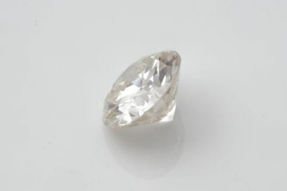 Brilliant-cut diamond on paper weighing approximately...