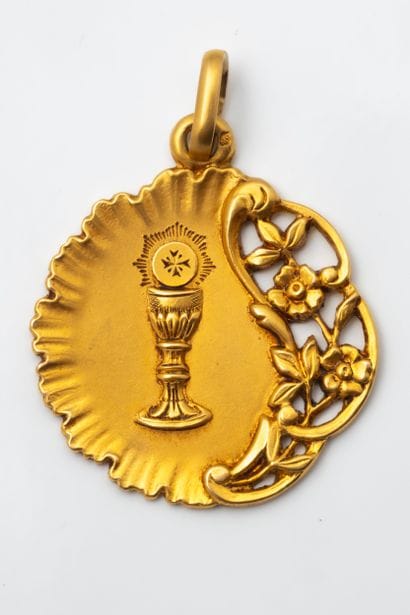 First Communion medal featuring a chalice...