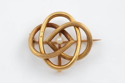 Brooch with intertwined yellow gold (750)...