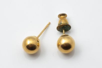 Pair of earrings, each featuring a hollow...