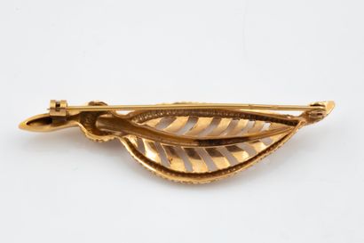 Openwork, tar-coated leaf brooch in yellow...